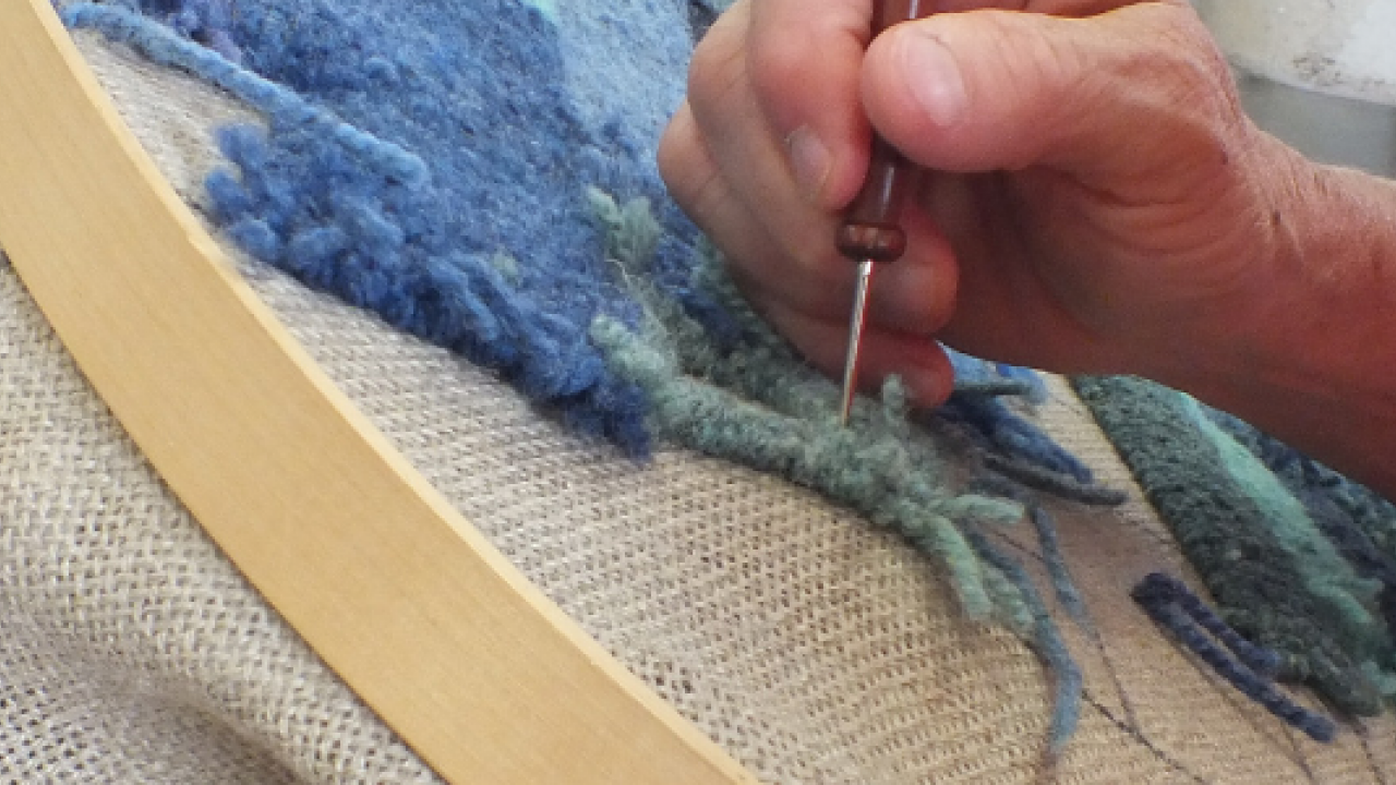 Person rug hooking