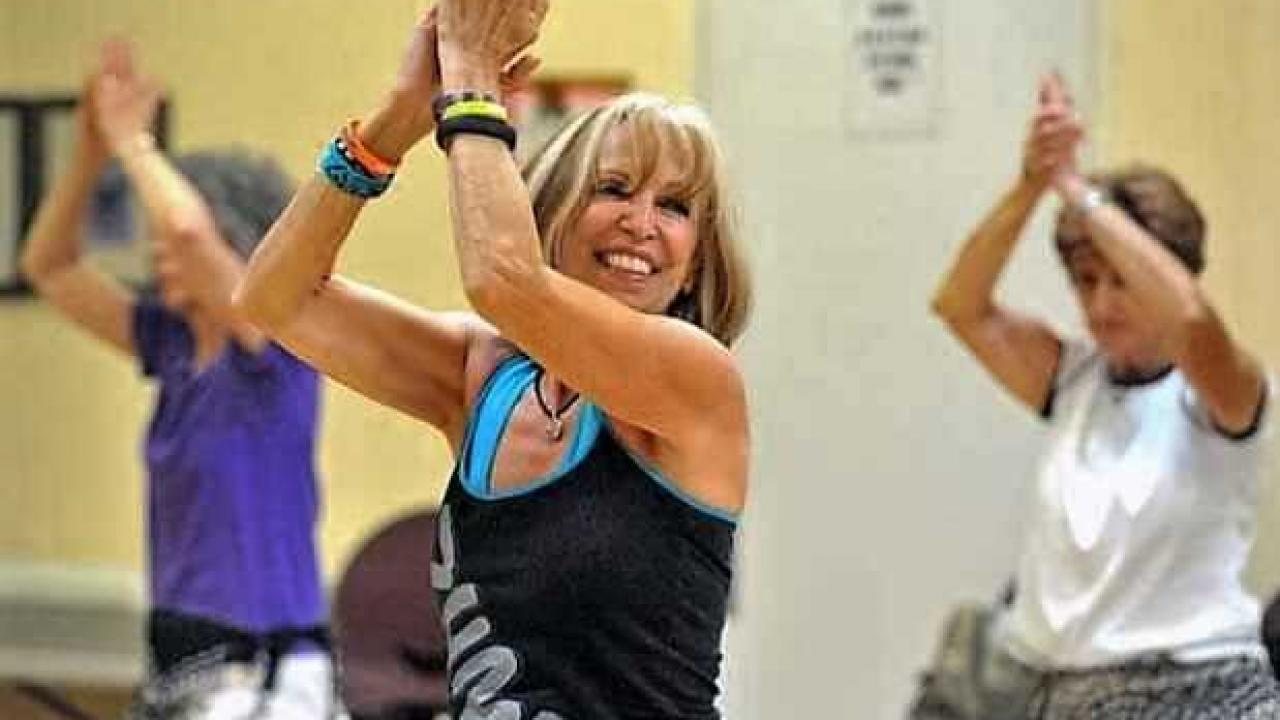 Adults doing zumba moves