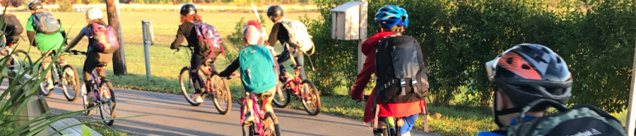 Students biking along trail